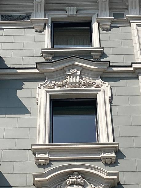 istock Elegant Stone Trimmed Windows from Historic Buildings – High-Resolution Architectural Photography 2242748935
