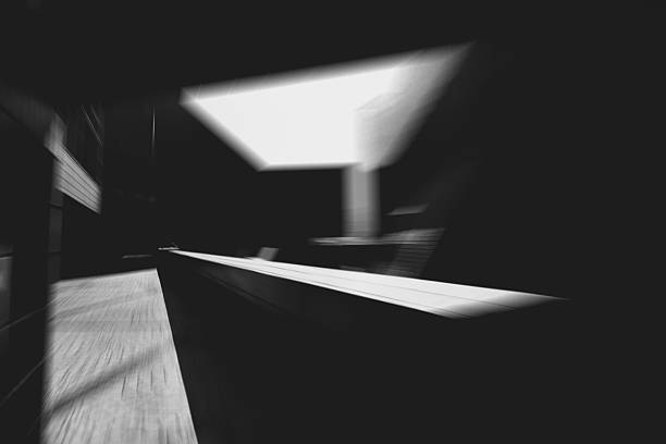 istock An abstract, blurred image showcasing Hong Kong's architectures, with a radial blur effect. The monochrome shot captures light and shadow. 2242749290