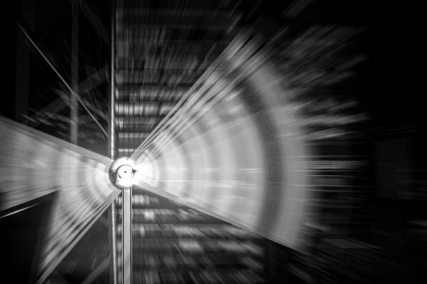 Abstract radial blur depicting Hong Kong architectures. The image uses grayscale to emphasize the dynamic movement.