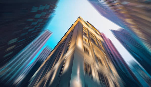 istock Abstract architectural scene in Hong Kong, with a radial blur effect creating movement. Skyscrapers dominate the view, reaching for the sky. 2242749681