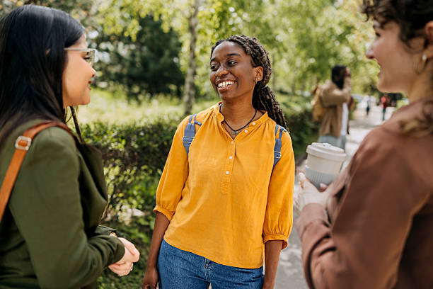 istock Group of students spending time together at a public park 2242752344