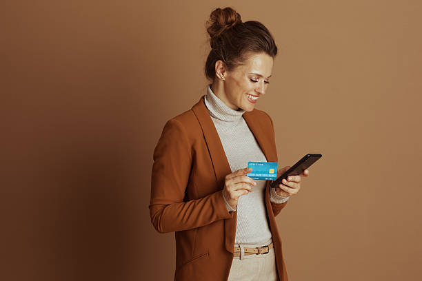 istock Concentrated Woman Making Mobile Payment 2242753372