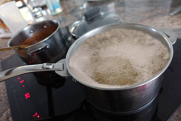 istock Boiling water in a saucepan on a ceramic hob 2242756215