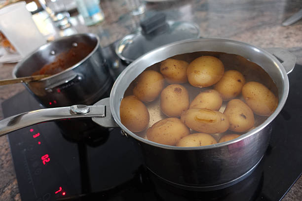 istock Boiled potatoes being prepared in a saucepan filled with water 2242756228