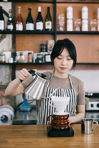istock Barista preparing pour over coffee in a modern cafe 2242758144