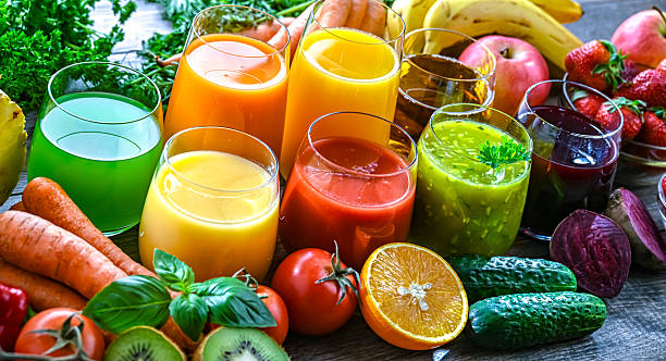 istock Glasses with fresh organic vegetable and fruit juices 2242762762