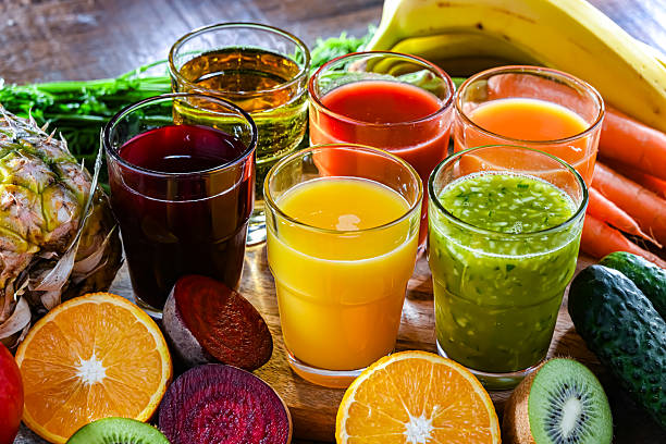 istock Glasses with fresh organic vegetable and fruit juices 2242762791