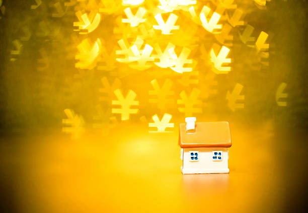 House model on Chinese yuan note background.