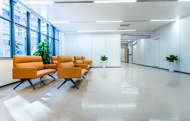 istock Modern waiting room in hospital with orange sofas 2242764083