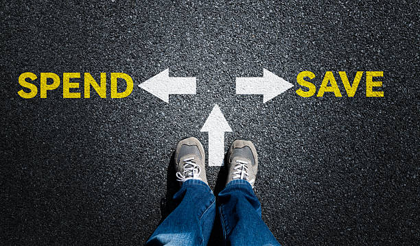 istock Top view of man standing by text SPEND or SAVE 2242764235