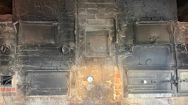 Old public village bakehouse with rustic oven doors, rural Germany