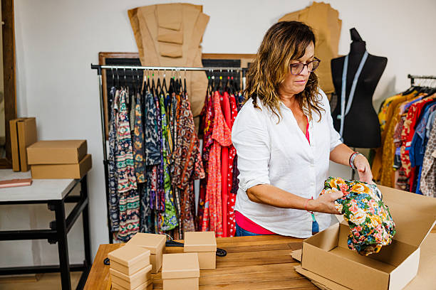 istock Mature Lady Working in Her Clothing Store 2242770900