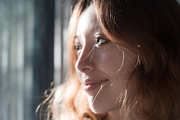 istock Peaceful moment of reflection by the window light 2242772442