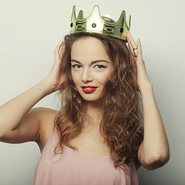 istock young blond woman in crown 2242772594