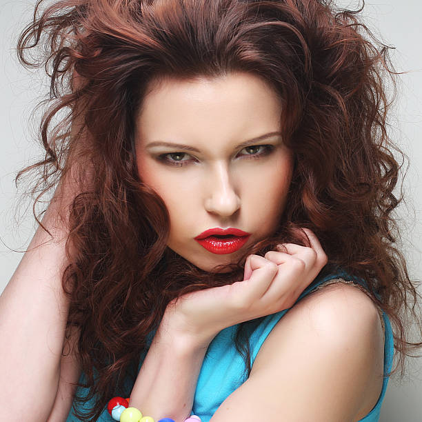 Beautiful young surprised woman. Studio shot.