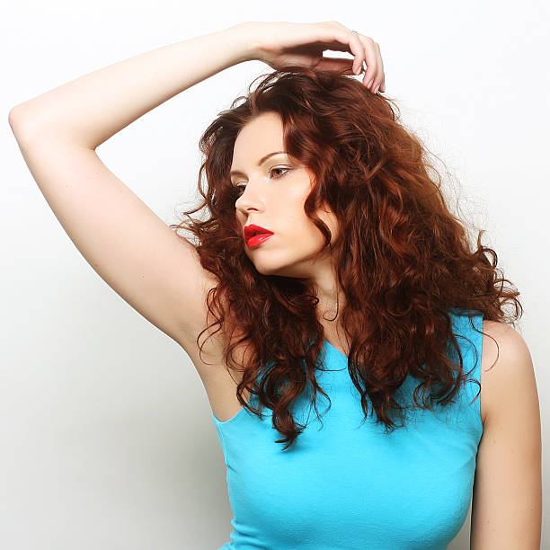 istock happy woman with curly hair 2242772755