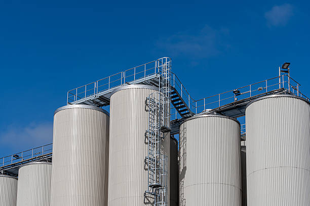 istock Storage silos of a factory against a blue sky 2242775774