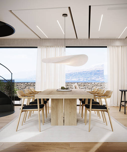 Modern dining room design with beautiful sea view. Contemporary interior design. Home.