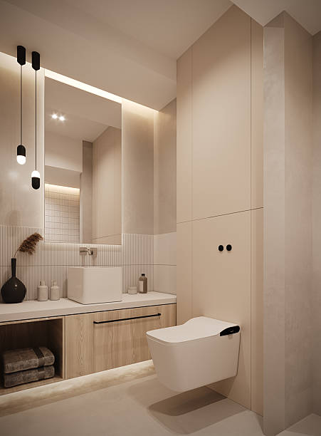 Modern minimalist bathroom interior with warm neutral tones and soft ambient lighting. Elegant white sanitary fixtures, textured wall tiles, light wood cabinetry, and subtle LED accents create a clean and sophisticated atmosphere.