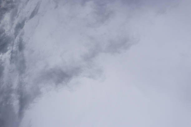 A dramatic sky filled with dark, grey storm clouds, creating an ominous and moody atmosphere. The clouds suggest the possibility of impending rain and add a sense of natural power.