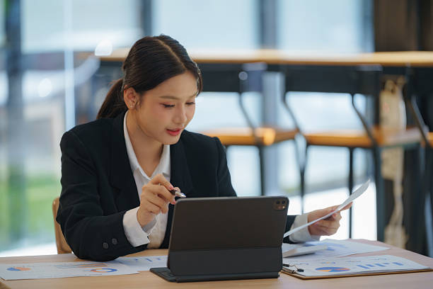 istock Confident businesswoman sitting at her workspace. 2242778121
