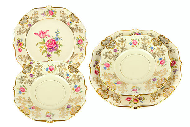 Vintage Porcelain Dinnerware with Gold Trim and Floral Pattern