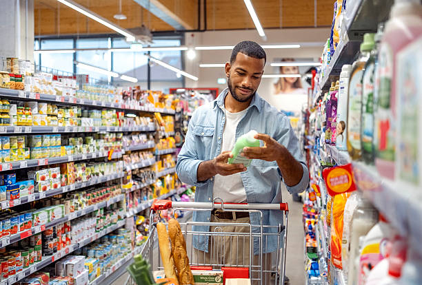 istock Content Individual Evaluating Household Item in Grocery Store Aisle 2242784817