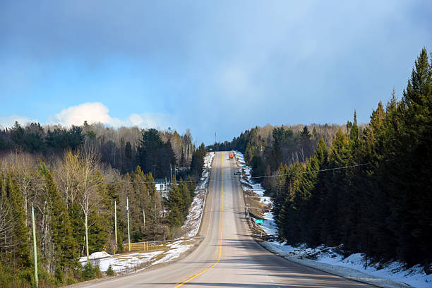 View of a highway that leads up a hill in Ontario Canada
