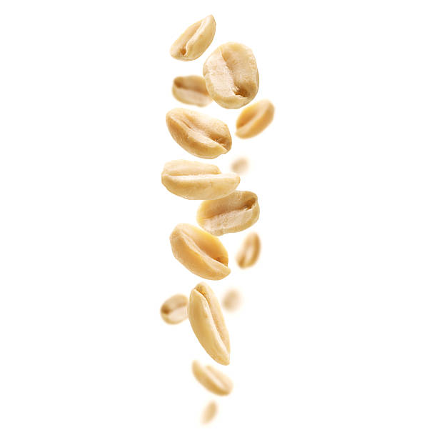 istock Peeled peanuts levitate on a white background 2242787343