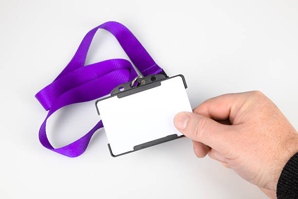 Holding an ID card with lanyard