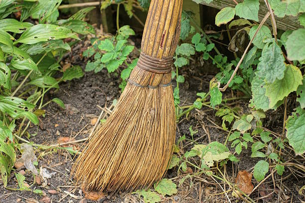 istock One old brown broom stands on the ground 2242790684