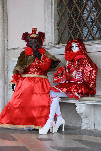 Venice, Italy - March 7, 2011: Two unidentified masked persons in costume Beauty and Beast. St. Mark's Square during Carnival of Venice. The 2011 carnival was held from February 26th to March 8th