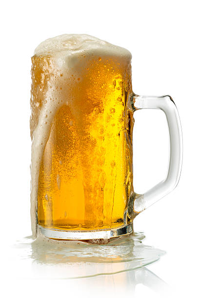 istock Cold lager beer with foam in a glass with condensation droplets 2242792254