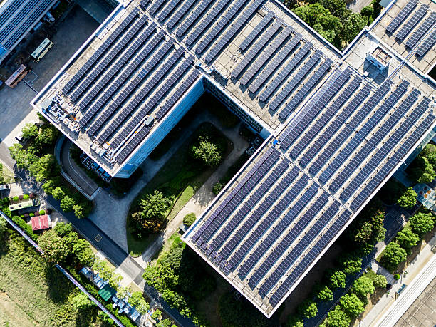 istock Solar panels on factory rooftop 2242792260