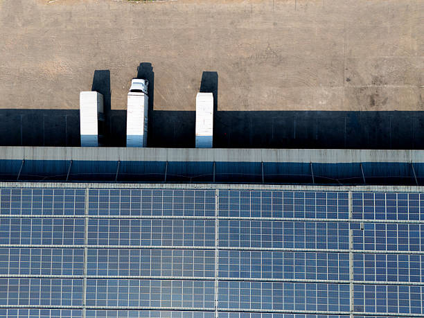 istock Truck loading in warehouse,solar panels on factory rooftop 2242796383