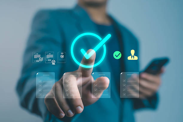 istock Businessman touching digital checkmark icon on virtual screen, representing online approval, task management, and digital verification. Concept of workflow automation, business efficiency, and data 2242800268