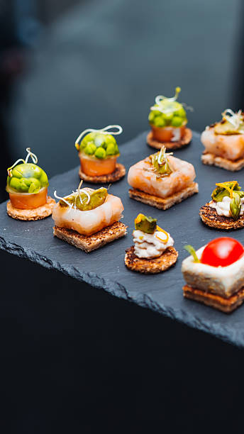 istock Elegant gourmet appetizers on a slate tray. 2242800654