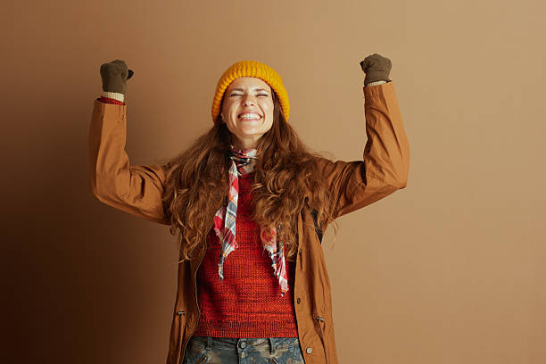 istock Joyful Hiker\'s Triumph in Warm Autumn Attire 2242807002