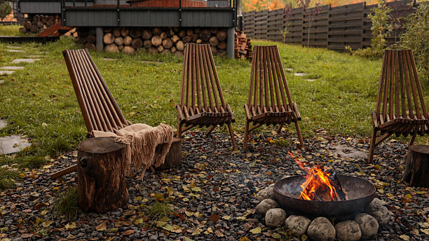 istock Cozy outdoor seating area with a crackling fire pit on a cool autumn evening 2242807189