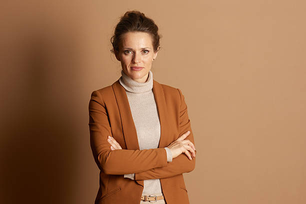 istock Authoritative Businesswoman in Brown Blazer 2242809801