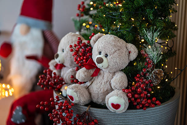istock Teddy bear toys decorating christmas tree with lights 2242809826