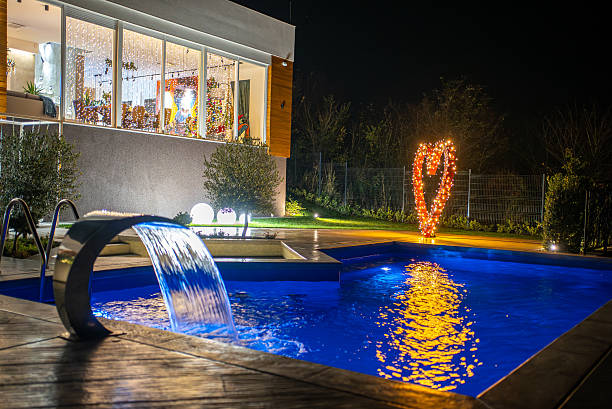 istock Modern house backyard with illuminated heart christmas lights at night 2242809875
