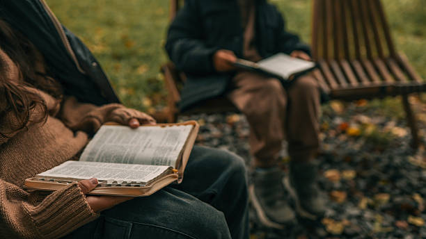 istock People reading books outdoors in a peaceful, natural setting 2242810235