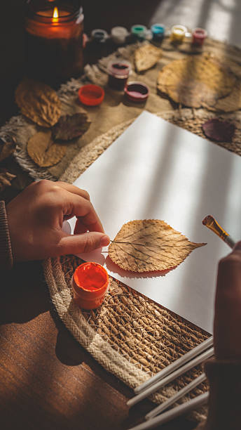 istock Autumn art project with a leaf and paint 2242811812