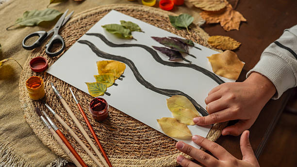 istock Child's Autumn Leaf Art Project 2242811835