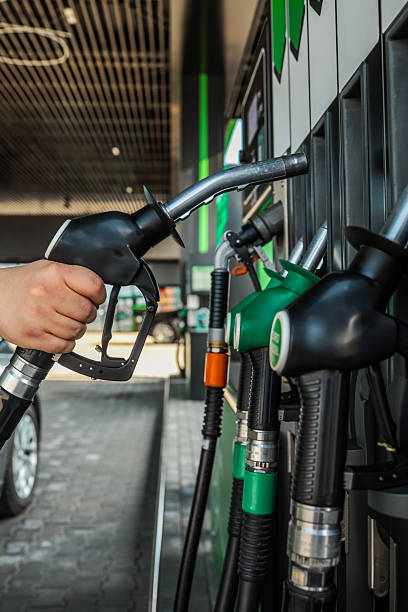 istock Fueling Up: Hand Holding a Gas Pump Nozzle 2242813595