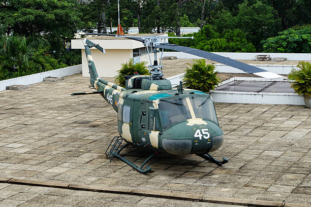 Helicopter Directly Above in Blue, wispy cloud background