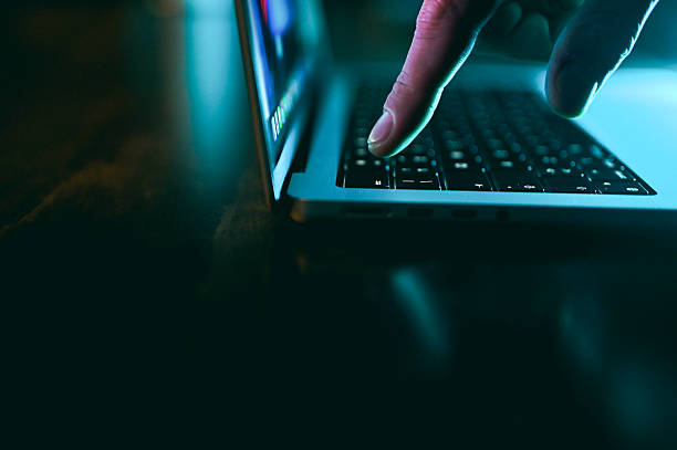 istock Hacker hand typing on laptop keyboard in dark 2242820345