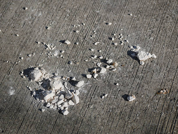 Ashes and paper remains of a firecracker battery on the pavement in the Thuringian city of Altenburg on New Year’s afternoon 2020