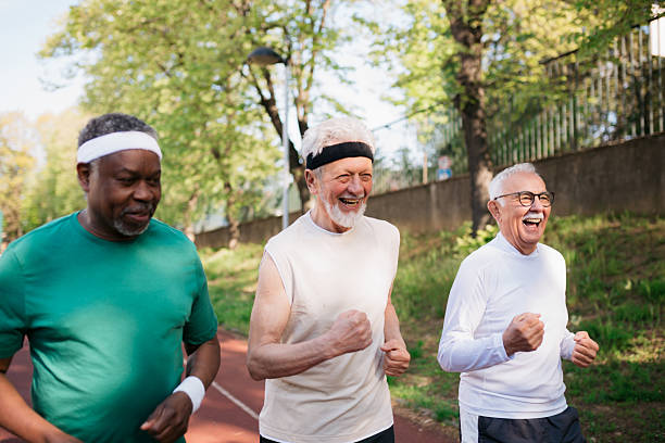 istock Senior men running and laughing together on track 2242836780